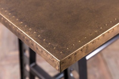 a frame table with brass top